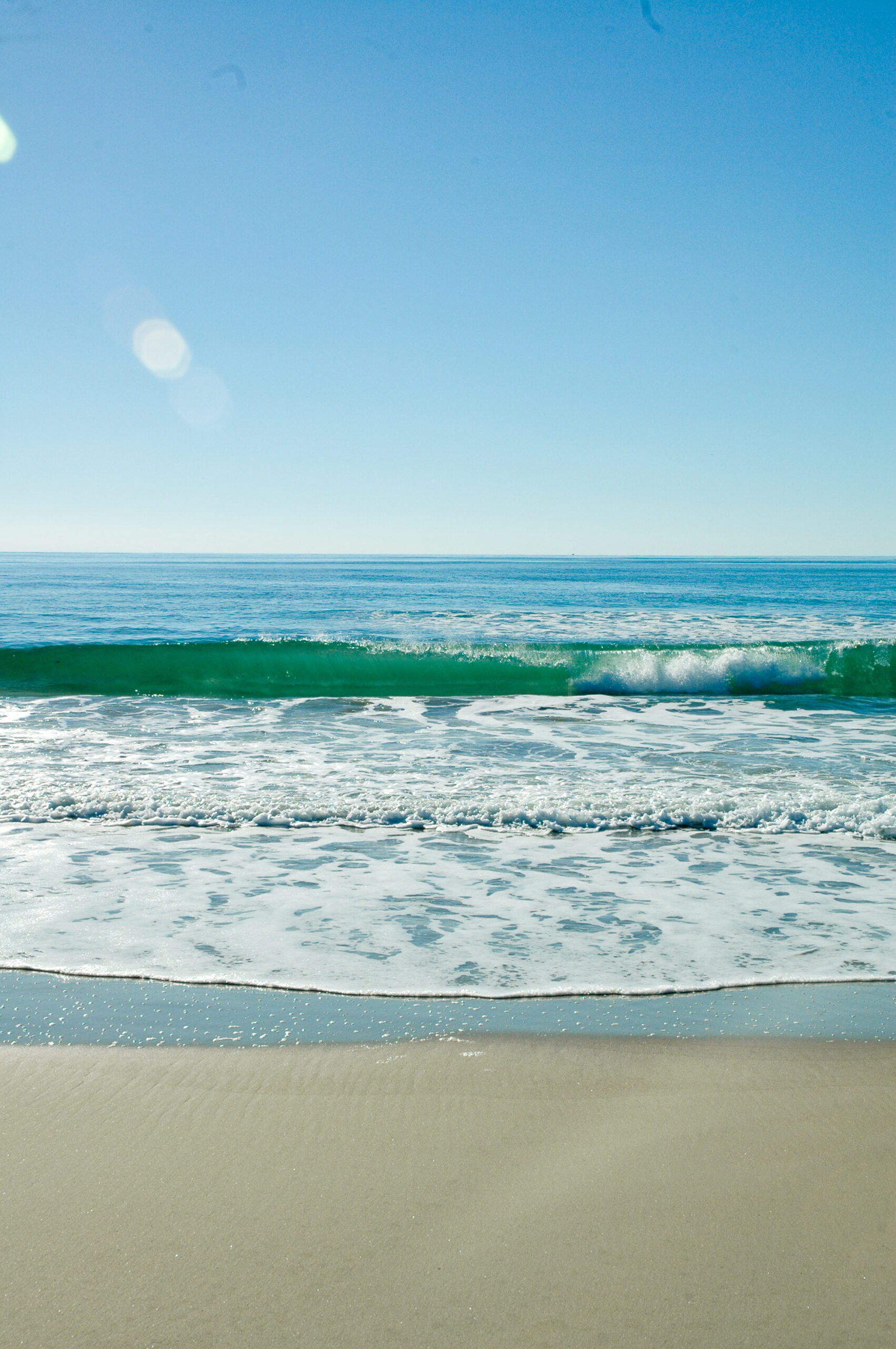 Wave Breaking on Beach near Hatteras Island Vacation Rentals