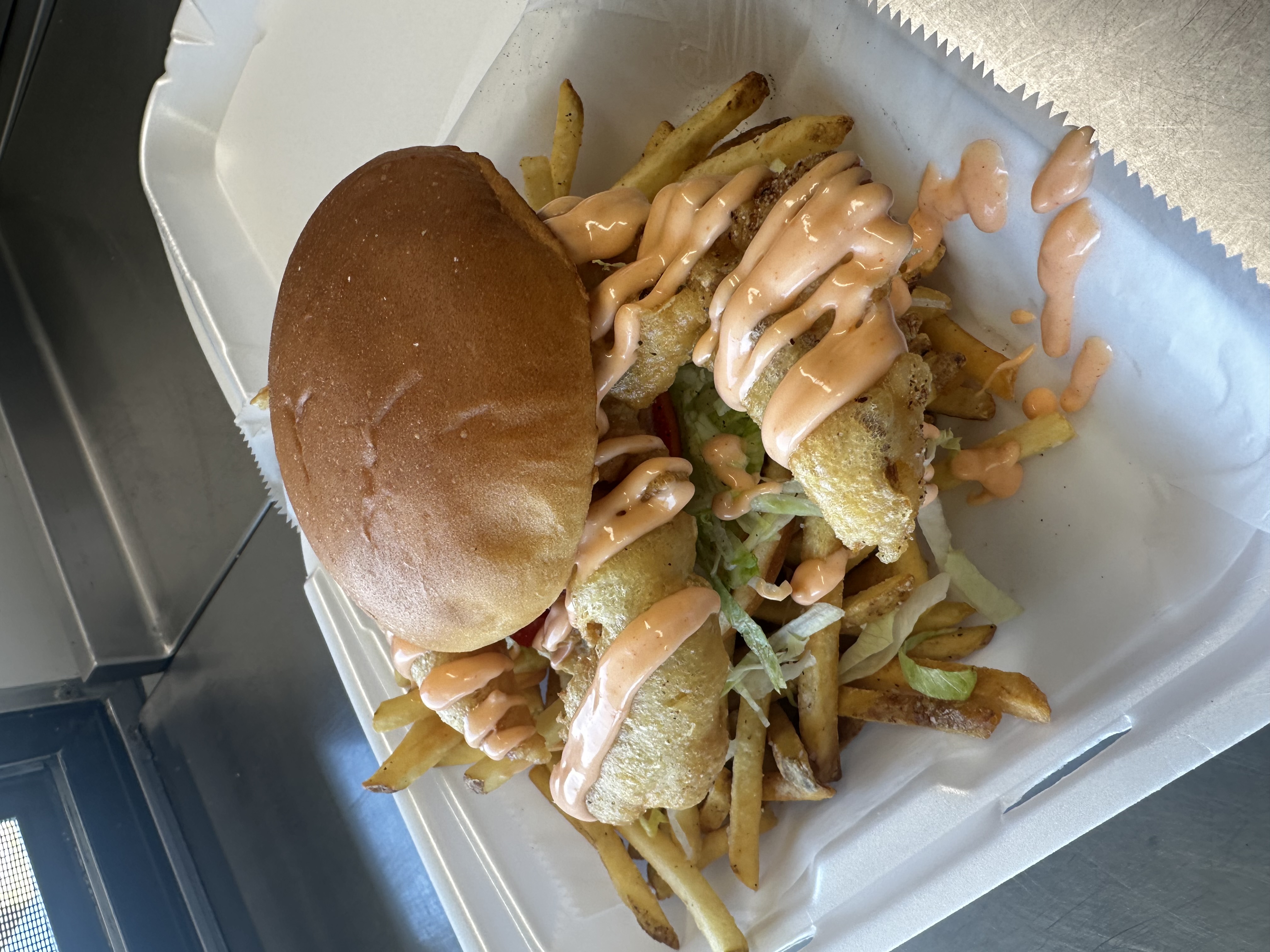 A softshell crab sandwich with kewpie mayo and fries