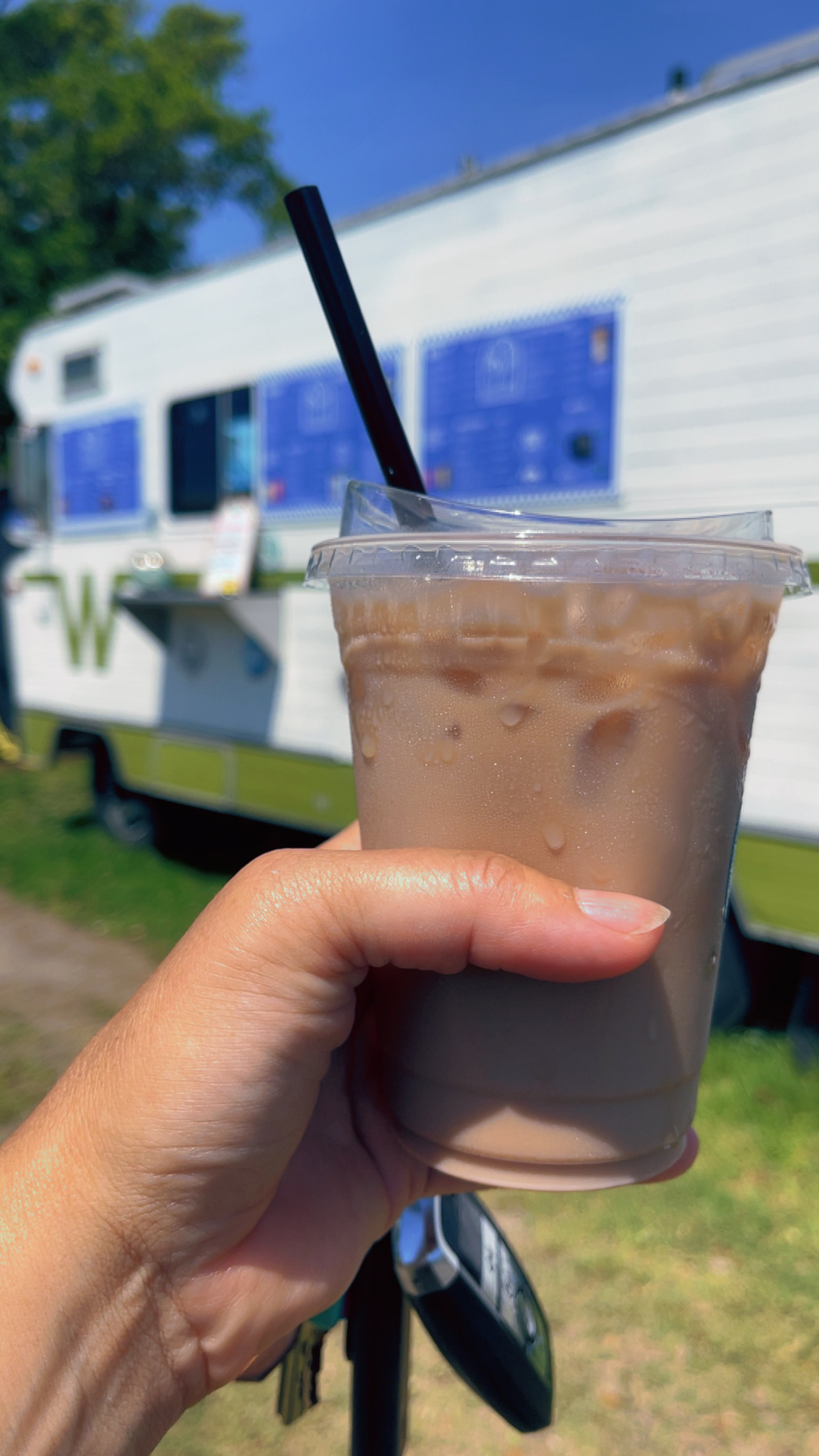 Drink by Hatti HoCo, shown in front of their vintage Winnebago on Hatteras Island in Frisco.